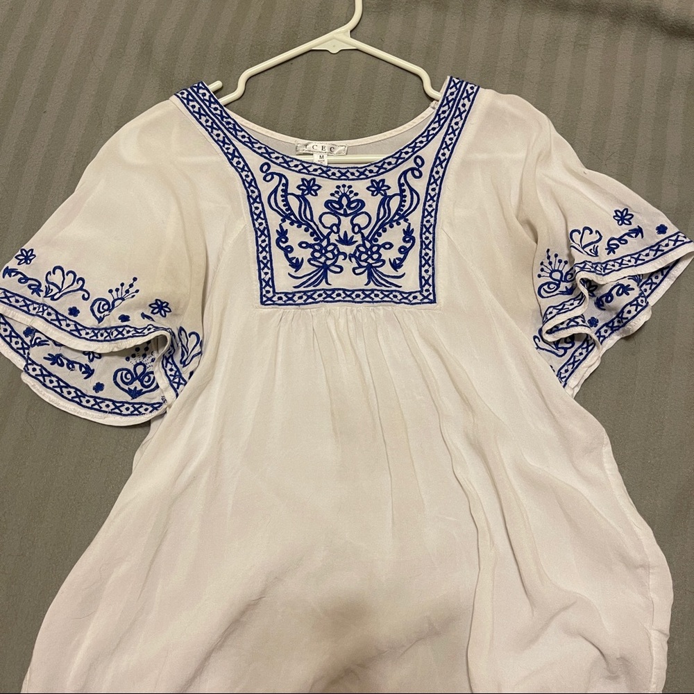 white shirt with blue detail